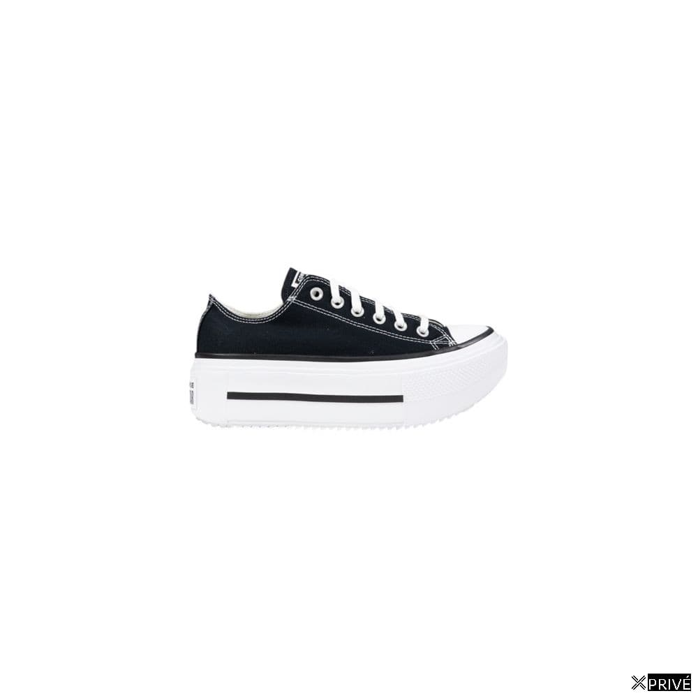 Chaussures de sport noir et blanc en Tissu — 1